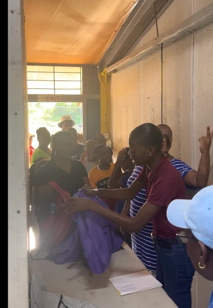 Community members lining up at the distribution event