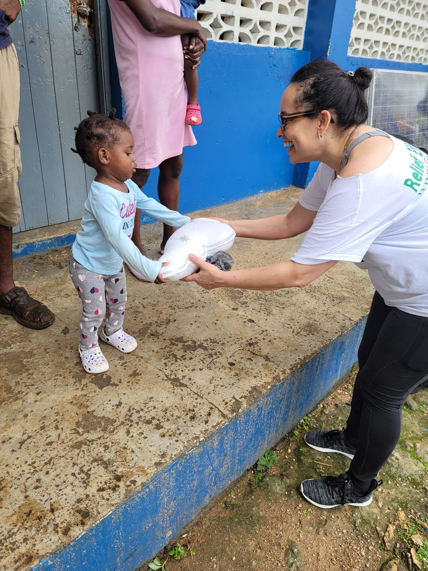 Volunteers organizing and distributing hurricane relief supplies