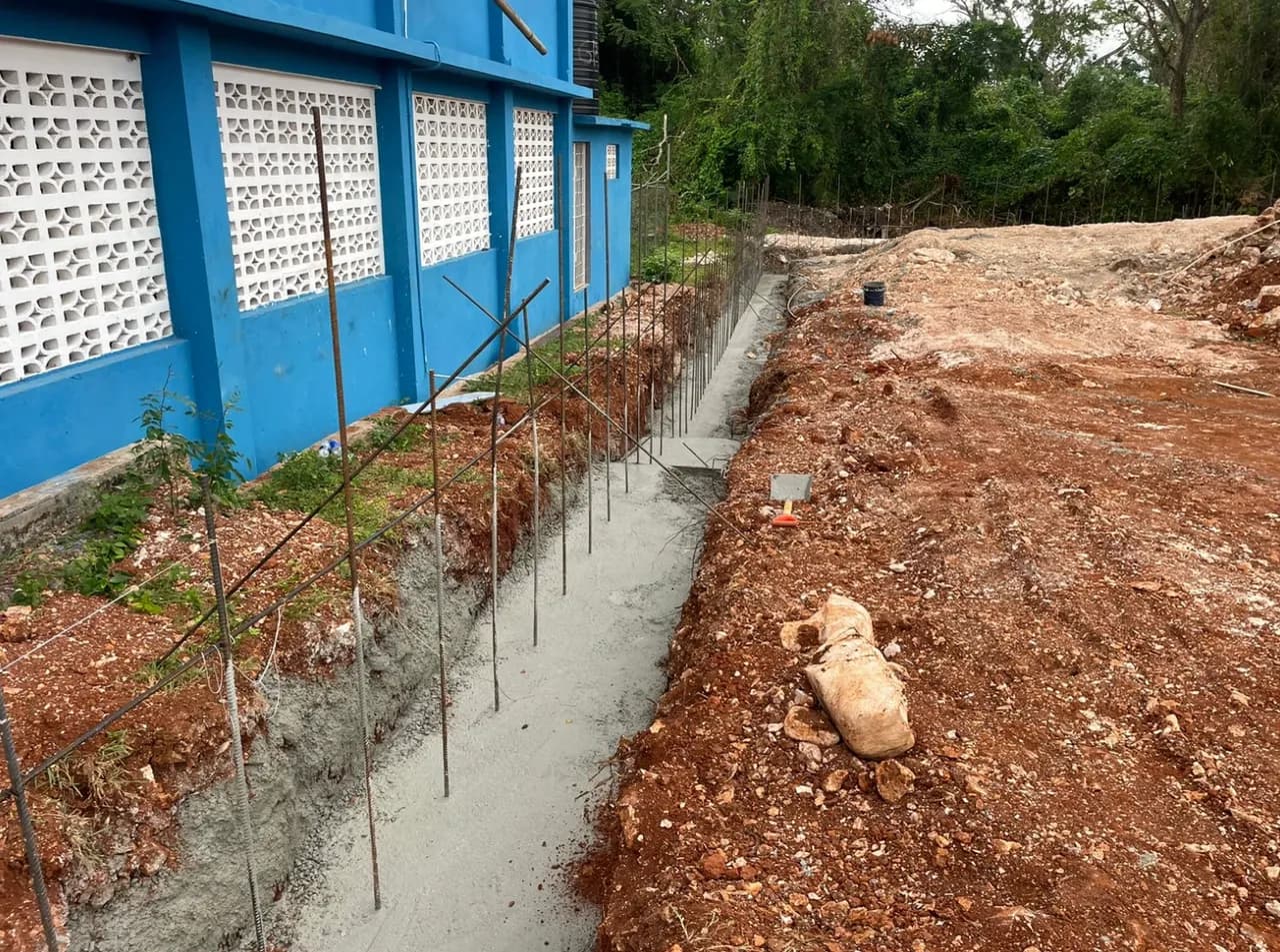 Rebar installation and concrete foundation being poured