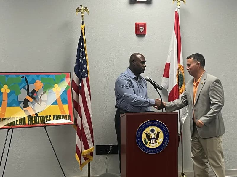 Edgar Pete Peters receiving recognition from Congressman Darren Soto at the Caribbean Heritage Month event